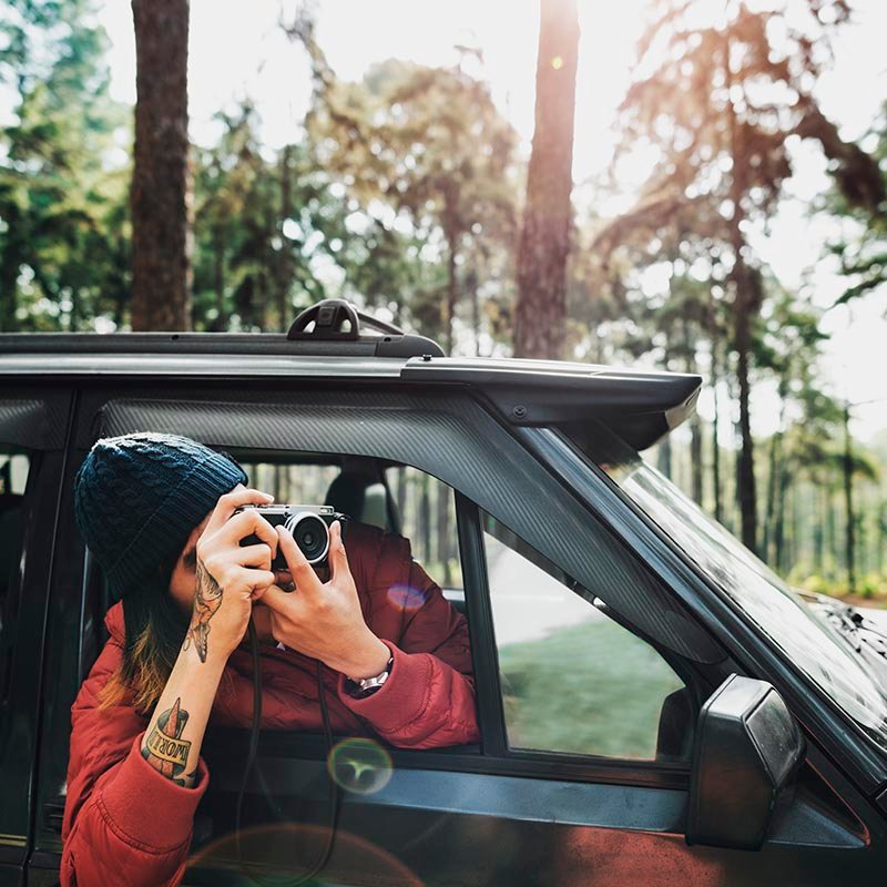 guy-taking-photos-road-trip-concept-PQ36NGL-copy.jpg